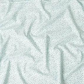 Light vista green blended cotton shirting fabric with blue and black print in leaf design-D9633
